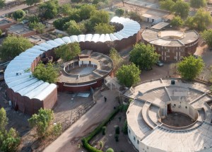 Tambacounda Hospital, the only major hospital in a vast region, serves over 40,000 patients per year from an area that stretches across the borders into Mali and Gambia. The doctors had previously been working under exceptionally difficult conditions in overcrowded, dilapidated spaces. The new building brings coherence to the overlapping treatment of the Maternity and Pediatric units by adjoining them, and greatly improves the comfort of patients and their visiting families. Herz's two-story structure has a curvilinear form that is graceful and welcoming as well as functional, and that relates beautifully to the circular buildings already essential to the hospital design. Accommodating 150 beds, it increases the capacity of the hospital while facilitating the smooth circulation of staff and patients and accommodating multiple communal spaces.